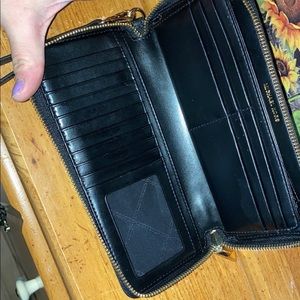 Micheal Kors Wallet. Only used once. Practically brand new. No stains / holes